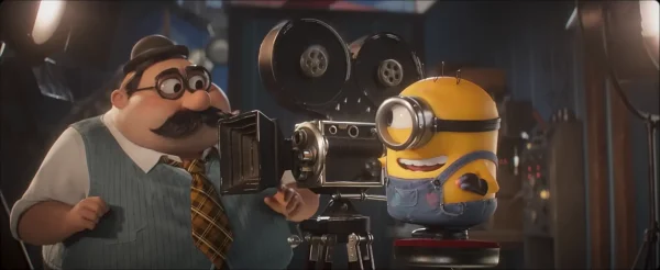 1920年代風の映画撮影用カメラを操作するミニオン